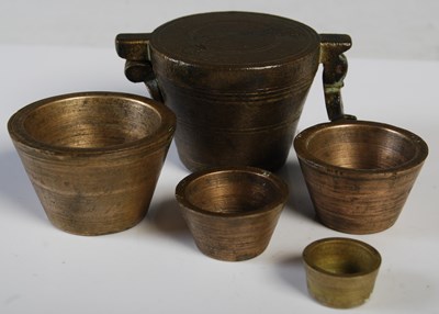 Lot 75 - A set of antique bronze apothecary bucket...