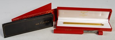 Lot 68 - Must De Cartier, a gold-plated pen in original...