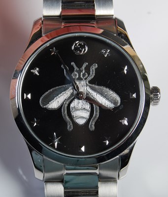 Lot 70 - A Gucci black bee dial stainless steel...