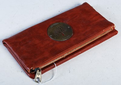 Lot 82 - A vintage Mulberry clutch bag with pierced...