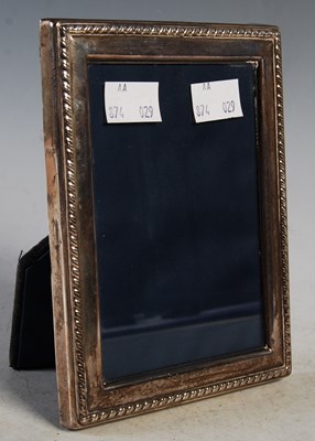 Lot 95 - A silver photograph frame with strut support,...