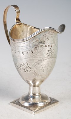 Lot 101 - A George III helmet-shaped cream jug with...