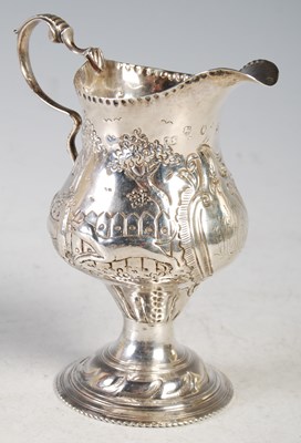 Lot 102 - A George III silver pear-shaped cream jug,...