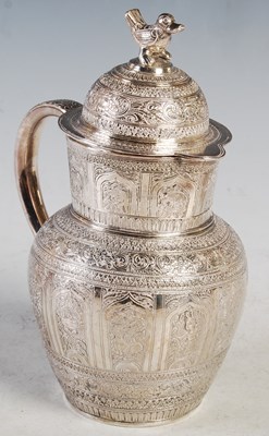 Lot 103 - A Burmese silver covered jug, of heavy gauge,...