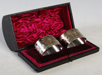 Lot 109 - A cased pair of London silver oval-shaped...