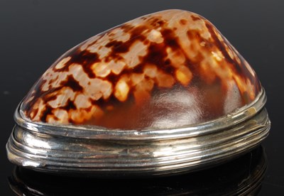 Lot 123 - A silver mounted shell snuff box, the hinged...