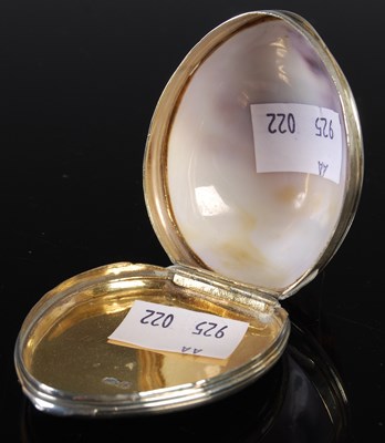 Lot 123 - A silver mounted shell snuff box, the hinged...