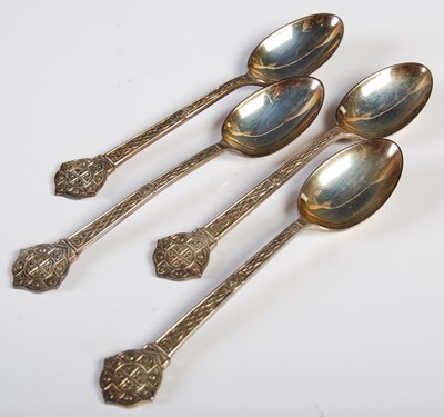 Lot 136 - Four Sheffield silver teaspoons with chased...