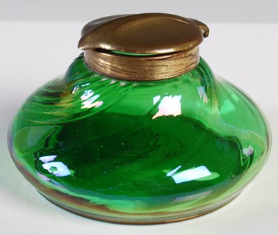 Lot 139 - An Art Nouveau iridescent green glass inkwell...