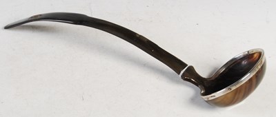 Lot 145 - A white metal mounted horn ladle, 39 cm long.