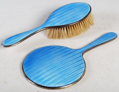 Lot 146 - A silver and blue enamel two-piece dressing...