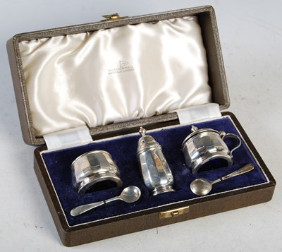 Lot 159 - A cased Birmingham silver three-piece cruet set.