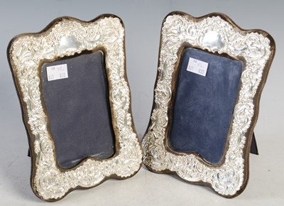 Lot 157 - A pair of silver photograph frames each with...