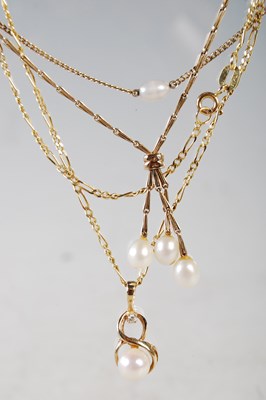 Lot 185 - Three yellow metal pendants and chains to...