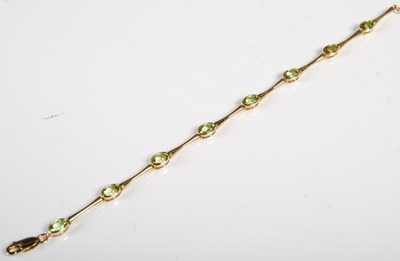 Lot 192 - A yellow metal bracelet set with eight oval...