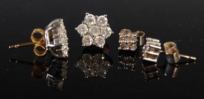 Lot 215 - Two pairs of white and yellow metal diamond...