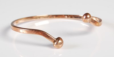 Lot 218 - A 9ct gold bangle, 17.2 grams.