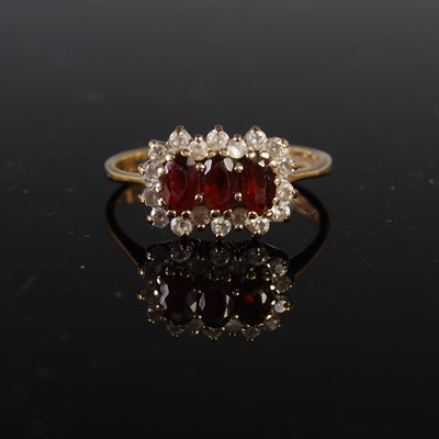 Lot 234 - A 9ct gold garnet and diamond chip cluster...