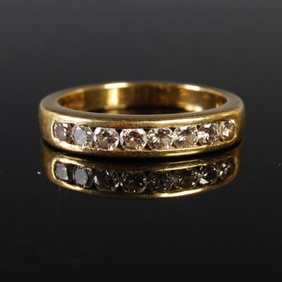 Lot 203 - An 18ct gold and diamond eight stone ring,...