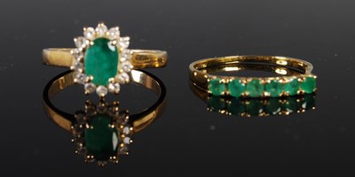 Lot 204 - A yellow metal emerald and diamond chip...