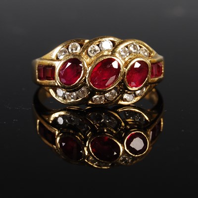 Lot 198 - A yellow metal ruby and diamond cocktail ring,...