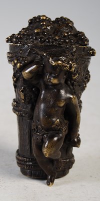 Lot 268 - A bronze snuff box in the form of a cherub...