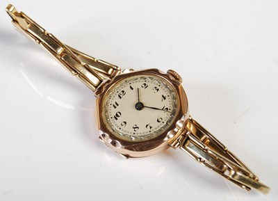 Lot 302 - A 9ct gold cased wristwatch with yellow metal...