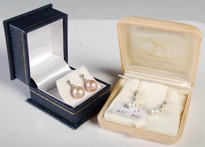 Lot 294 - A pair of white metal diamond and pearl drop...