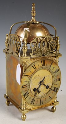 Lot 360 - An early 20th century brass lantern clock with...