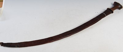 Lot 370 - A sabre sword in leather scabbard with carved...