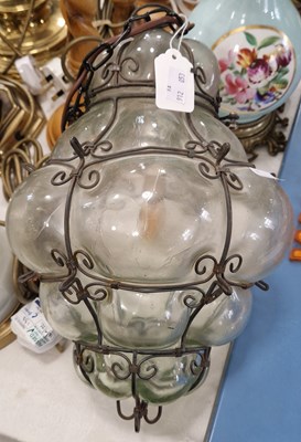 Lot 483 - A glass and wire bound hanging lightshade,...