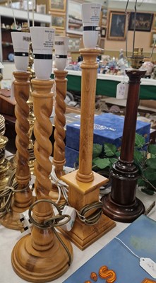 Lot 485 - Three spiral carved table lamps and two other...