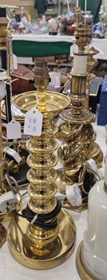 Lot 487 - A collection of four assorted brass table lamps.