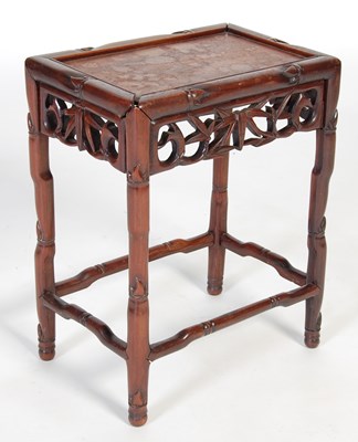 Lot 90 - A Chinese dark wood occasional table, late...