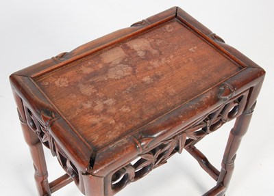 Lot 90 - A Chinese dark wood occasional table, late...