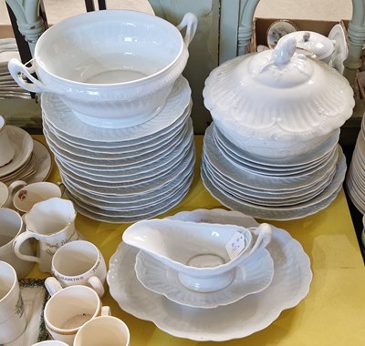 Lot 446 - A Limoges white glazed part dinner set.