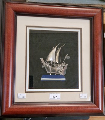 Lot 347 - A white metal model of an Arab dhow sailing...