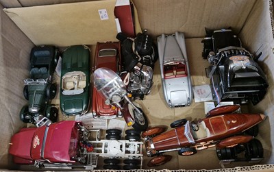 Lot 583 - A box containing assorted model cars, trucks,...