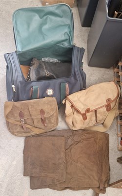 Lot 622 - A bag containing assorted fishing tackle, bags,...