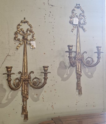 Lot 699 - A pair of gilt brass Neoclassical style two...