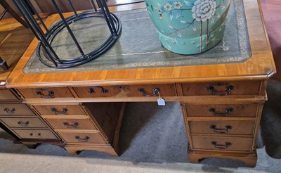 Lot 736 - A reproduction blonde wood pedestal desk with...