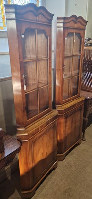 Lot 717 - A pair of reproduction corner cupboards, each...