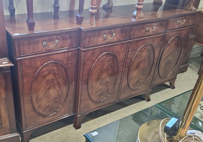 Lot 723 - A reproduction mahogany breakfront sideboard,...