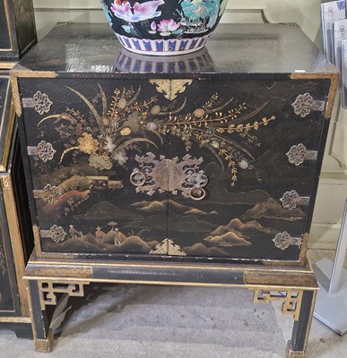 Lot 757 - A gilt metal mounted black lacquer cabinet on...