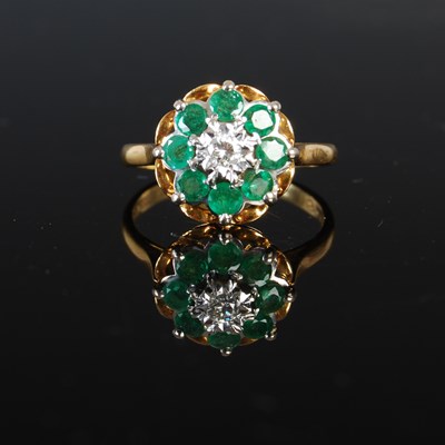 Lot 309 - An 18ct gold emerald and diamond cluster ring,...