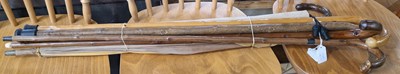 Lot 793 - Four assorted walking canes and two umbrellas.