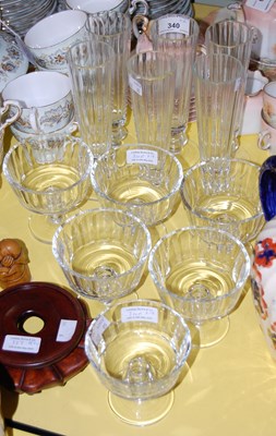 Lot 340 - Six clear glass champagne flutes together with...