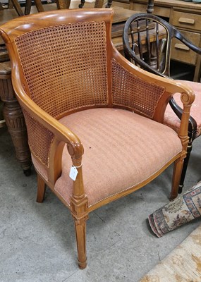 Lot 808 - A double canework bergère armchair with...