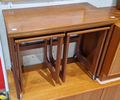 Lot 819 - A nest of three teak square occasional tables...