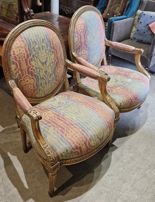 Lot 821 - A pair of gilt wood upholstered fauteuil...